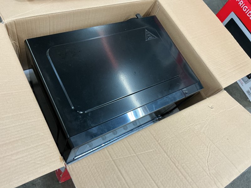 Condition photo showing As Is for Frigidaire EMW112OAMZ Stainless Steel Microwave Oven, Multi Function, Programmable, 1.1 Cu Ft 1000-Watt, residential kitchen, Stainless