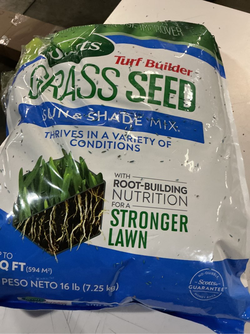 Condition photo showing As Is for scotts turf builder grass seed sun and shade mix - grass seed plus lawn fertilizer and soil improver, covers up to 6,400 sq. ft., 16 lb.