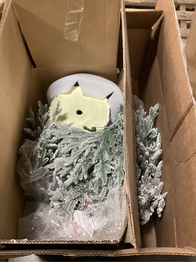 Condition photo showing As Is for Puleo International 6ft Pre-Lit Potted Flocked Arctic Fir Pencil Christmas Tree with 120 Warm White Lights, 1325 Realistic Dense Snow Flocked Branch Tips, Easy Setup Artificial Trees with Sturdy Stand 6' Flocked Arctic Fir 120 Clear Lights