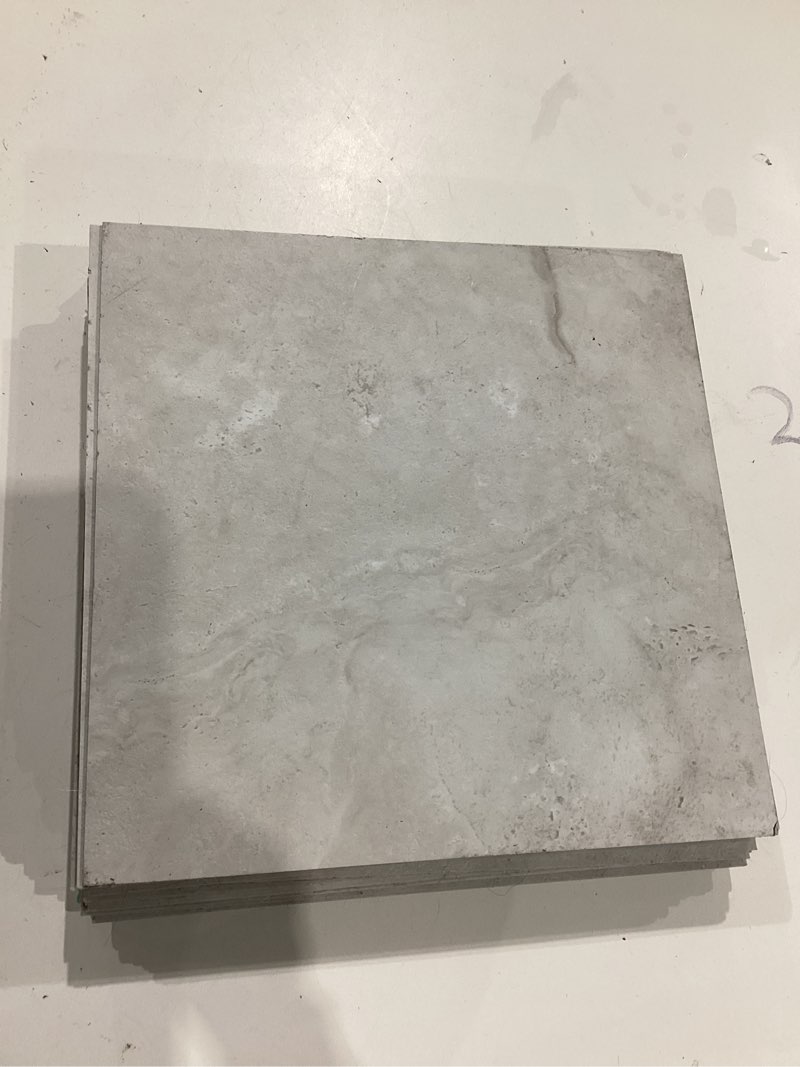 Condition photo showing As Is for style selections alpine stone off-white stone look 3-mil x 12-in w x 12-in l water resistant peel and stick luxury vinyl tile flooring (1-sq ft/ piece)