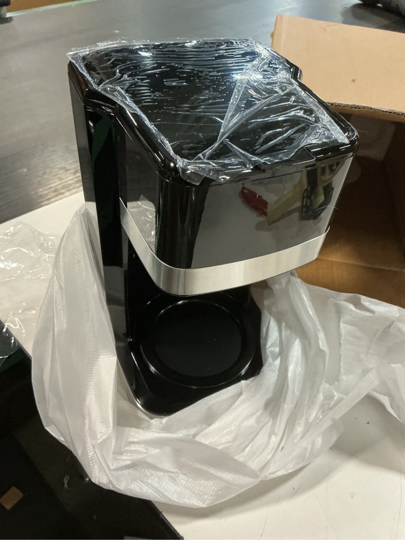 Condition photo showing As Is for ( incomplete) Amazon Basics 12 Cup Drip Coffee Maker, Coffee Machine with Glass Coffee Pot (1.9 Qt), Auto Shut-off, Auto Pause, Removable Filter Basket, Black & Silver 12-Cup Non-Programmable - New Model