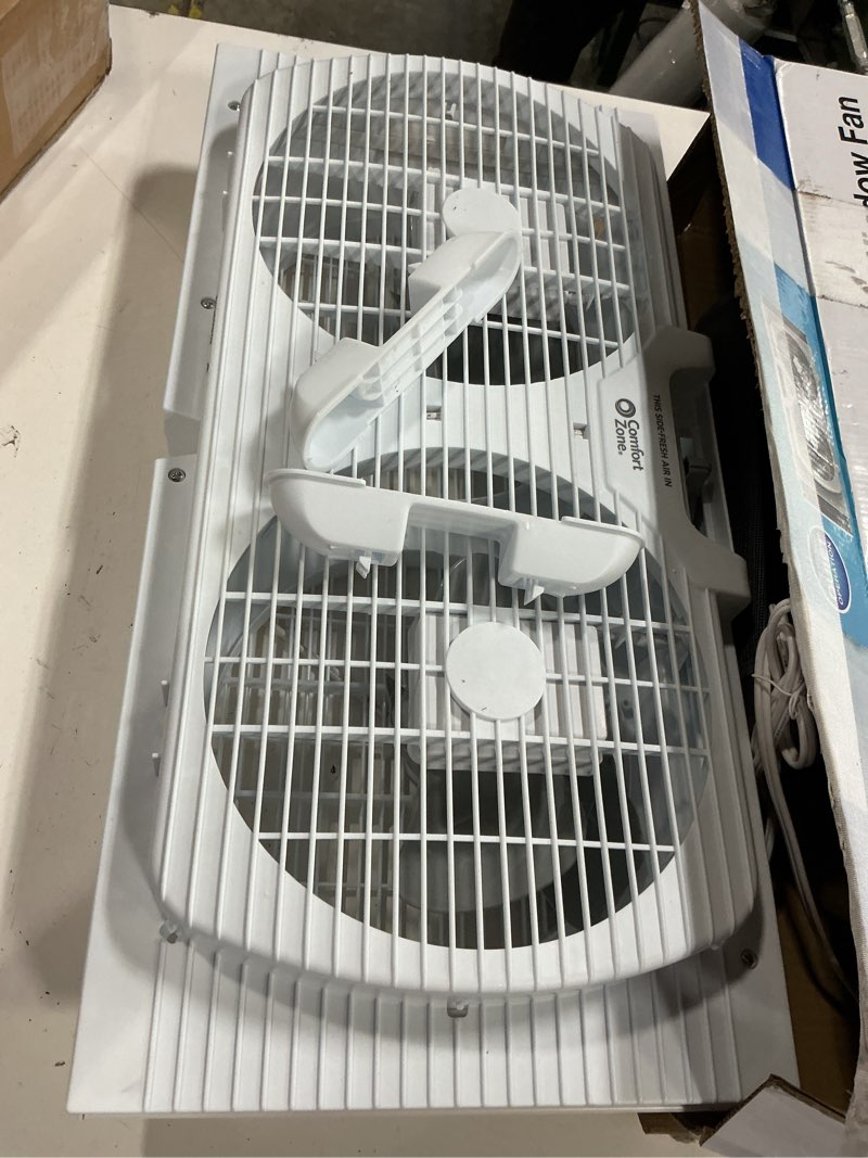 Condition photo showing As Is for comfort zone twin window fan with reversible airflow control, 9 inch, auto-locking expanders, 2 speed fan, dual fan, exhaust, airflow 9.84 ft/sec, ideal for home, kitchen, bedroom & office, cz319wt white 9"