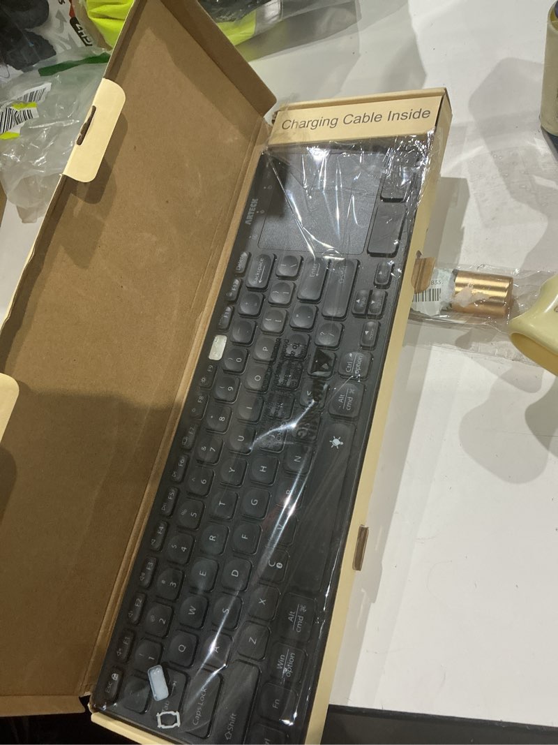 Condition photo showing As Is for arteck universal backlit 7-colors bluetooth touch tv keyboard with easy media control and build-in touchpad for tv-connected computer, smart tv, desktop, laptop, ipad, surface, tablet, htpc