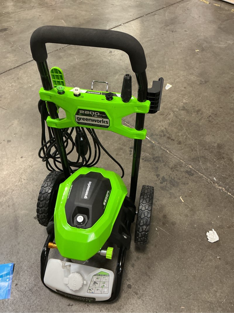 Condition photo showing As Is for greenworks 2200-psi 1.2-gpm cold water electric pressure washer with 4 spray tips