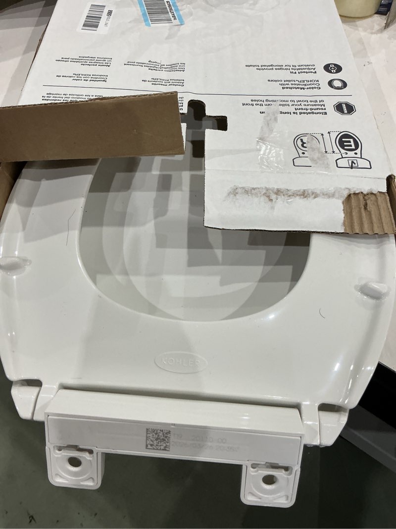 Condition photo showing As Is for kohler 20110-0 brevia, slow close toilet seat, elongated toilet seat, grip-tight bumpers quick-attach hardware, white white elongated quiet-close