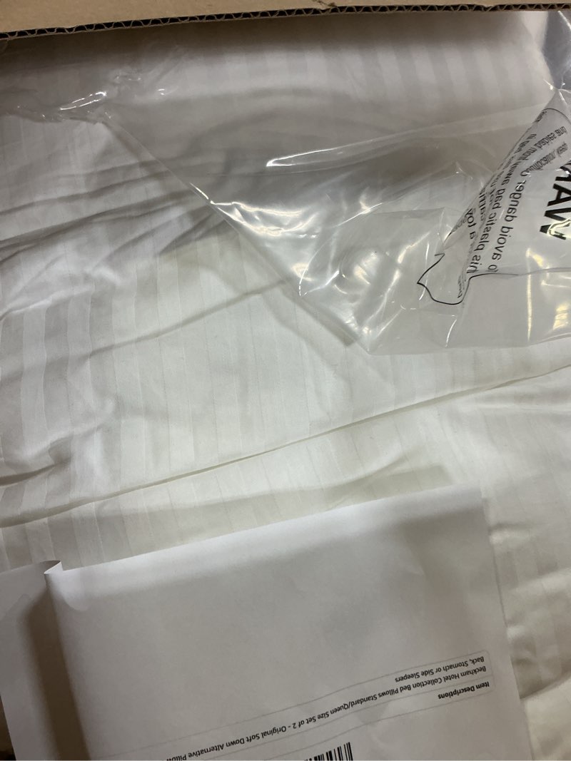 Condition photo showing As Is for Amazon Basics Down Alternative Bed Pillows and Pillow Protector Case 2-Piece Set, Medium Density, Standard - Pack of 2, White, 26"L x 20"W Standard (2 Pillows + 2 Protectors) Medium