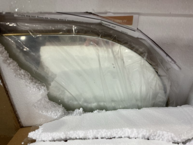 Condition photo showing Good Condition for ANDY STAR Gold Bathroom Mirror, 24"x32" Brushed Brass Asymmetrical Wall Mirror in Stainless Steel Metal Frame, Unique Vanity Mirror with Modern Curved Design, Ideal for Bathroom, Bedroom, Entryway Brushed Gold 32"L x 24"W