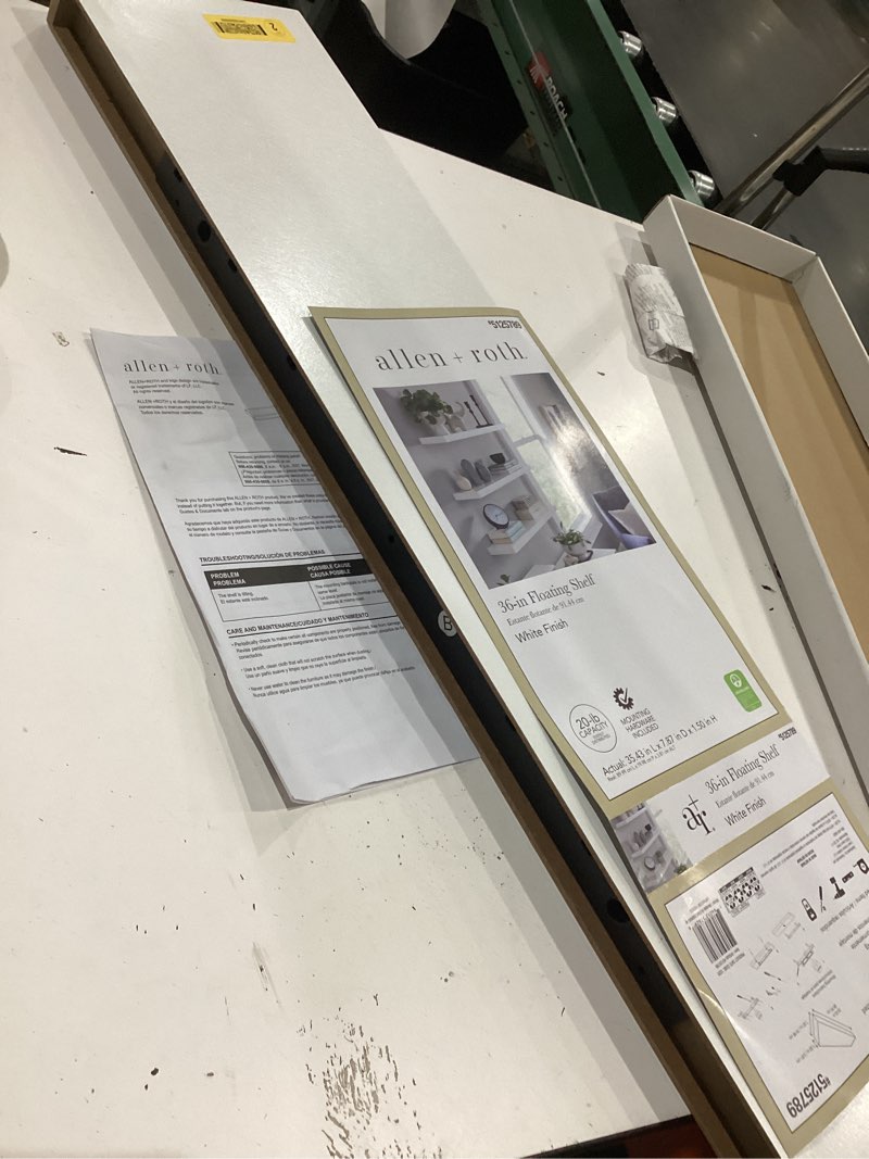 Condition photo showing As Is for allen + roth 36-in l driftwood white particleboard rectangular floating shelf