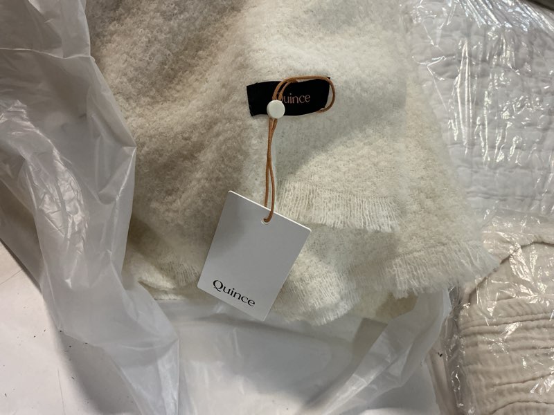 Condition photo showing New/Like New for quince white brushed cashmere blanket