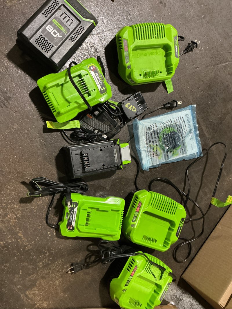 Condition photo showing As Is for Assorted Greenworks Batteries & Chargers