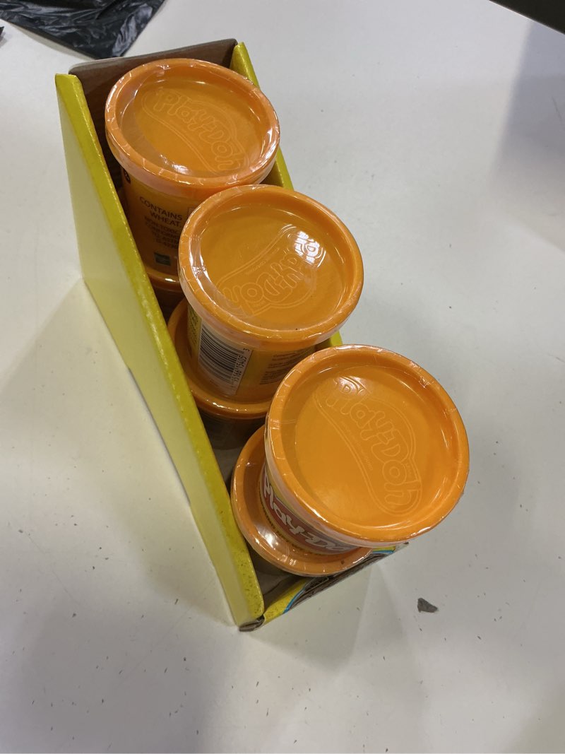 Condition photo showing New/Like New for playdoh (orange)