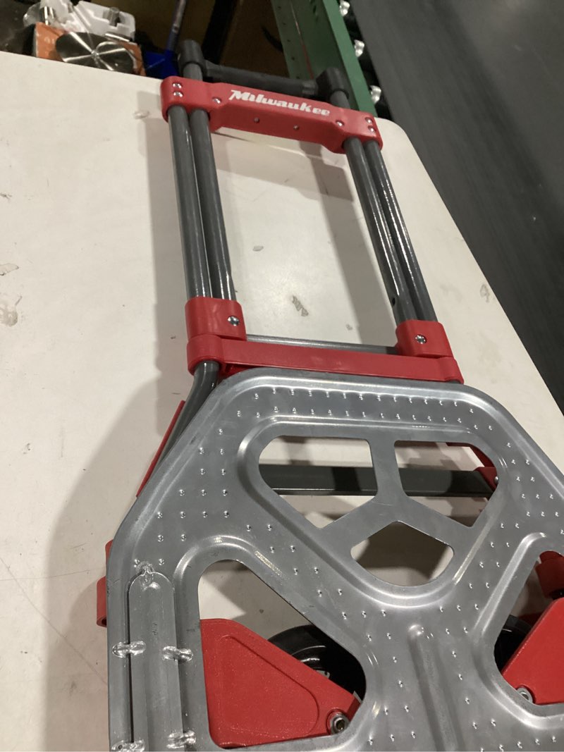 Condition photo showing As Is for Milwaukee 150-lb Capacity 2 -Wheel Red Steel Folding hand truck