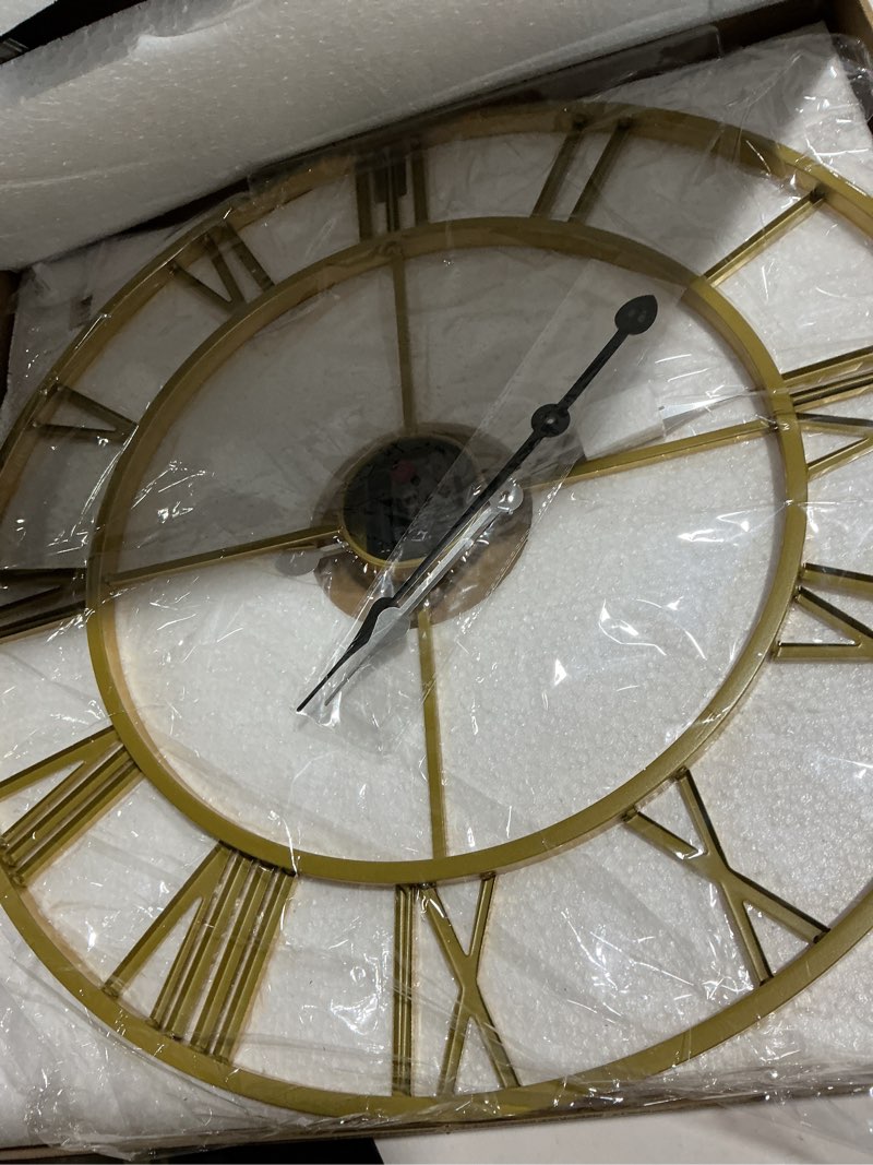 Condition photo showing As Is for 1st owned Large Wall Clock Metal Retro Roman Numeral Clock, Modern Round Wall Clocks Almost Silent, Easy to Read for Living Room/Home/Kitchen/Bedroom/Office/School Decor (Gold, 24 Inch) Gold 24 Inch
