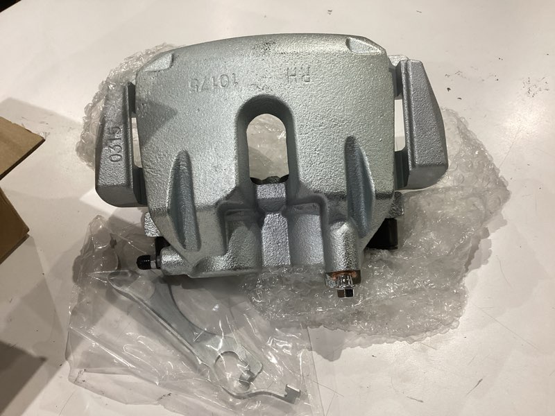 Condition photo showing As Is for front passenger side brake caliper