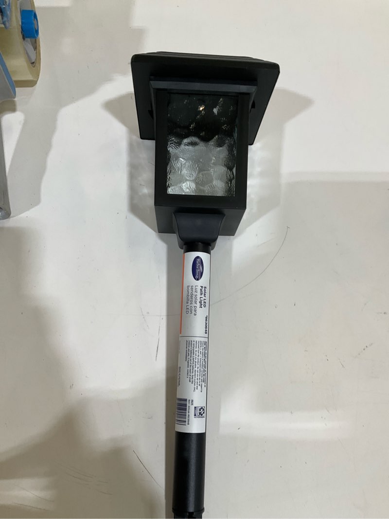 Condition photo showing As Is for harbor breeze 15lm solar path light 15 -lumens black solar led outdoor path light ( 3000-k )