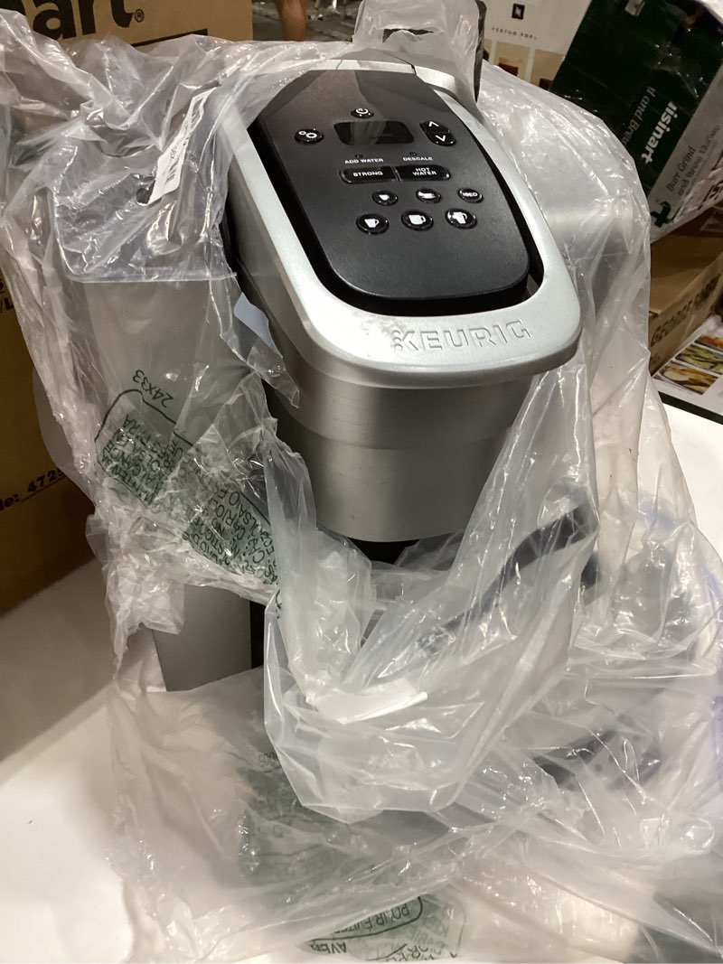 Condition photo showing As Is for keurig k-elite single serve k-cup pod coffee maker, with strength and temperature control, iced coffee capability, 8 to 12oz brew size, programmable, brushed silver