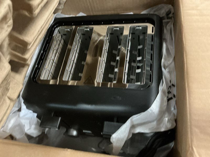 Condition photo showing As Is for Amazon Basics 4 Slice Toaster, With 7 Browning Settings, Extra Wide Slots For Bagels and Special Breads, Removable Easy-to-Clean Crumb Trays, Cancel/Defrost/Bagel Buttons, 1500W, Black & Silver 4 Slice Matte Black Front