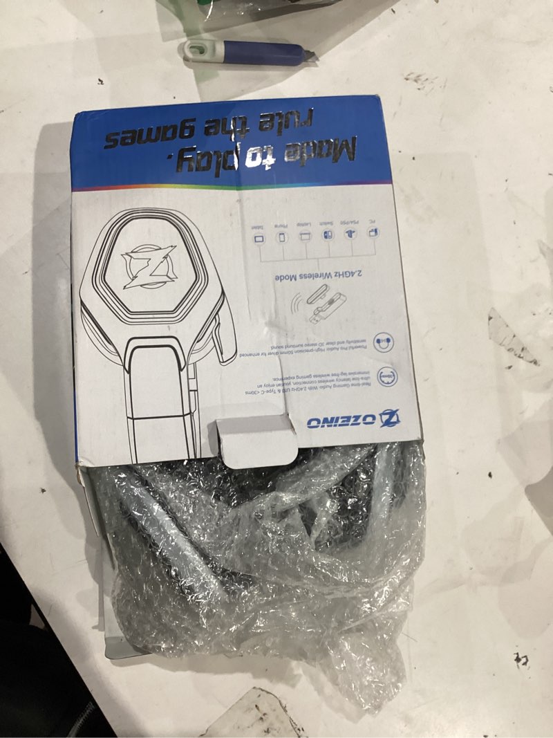 Condition photo showing Good Condition for Ozeino 2.4GHz Wireless Gaming Headset for PC, Ps5, Ps4 - Lossless Audio USB & Type-C Ultra Stable Gaming Headphones with Flip Microphone, 40-Hr Battery Gamer Headset for Switch, Laptop, Mobile, Mac Black and White