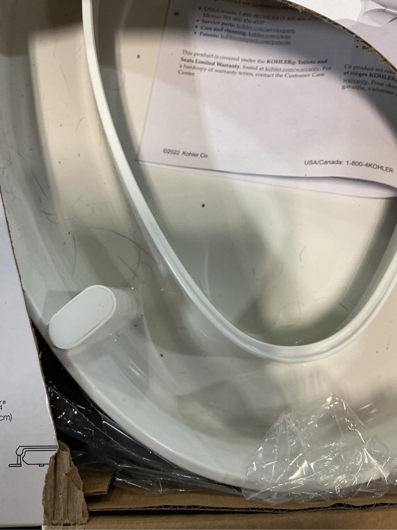 Condition photo showing As Is for kohler 25875-0 hyten 3" height, elevated soft close elongated toilet seat, contoured seat with grip-tight bumpers, quick-attach hardware, no slam toilet seat, white white elongated