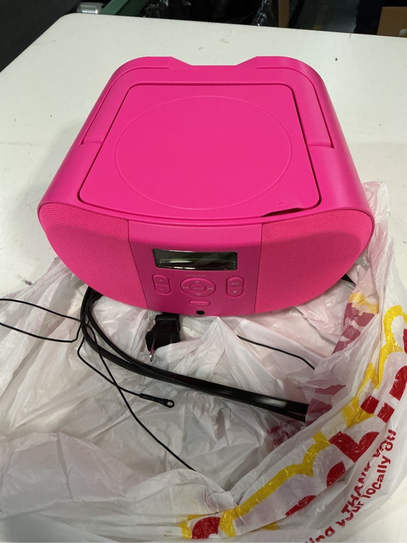 Condition photo showing As Is for onn. cd boombox pink