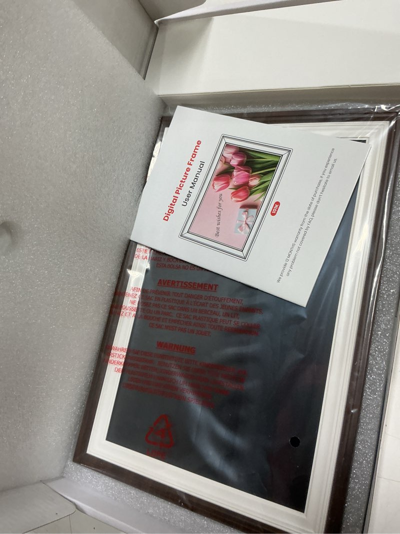 Condition photo showing New/Like New for Frameo 10.1" Wood WiFi Digital Picture Frame with 32GB Memory, 1280 x 800 IPS HD Touch Screen Electronic Photo Frame, Auto-Rotate, Slideshow, Wall Mountable, Share Photos/Video Remotely Anywhere 10.1 inch Brown Wood & White