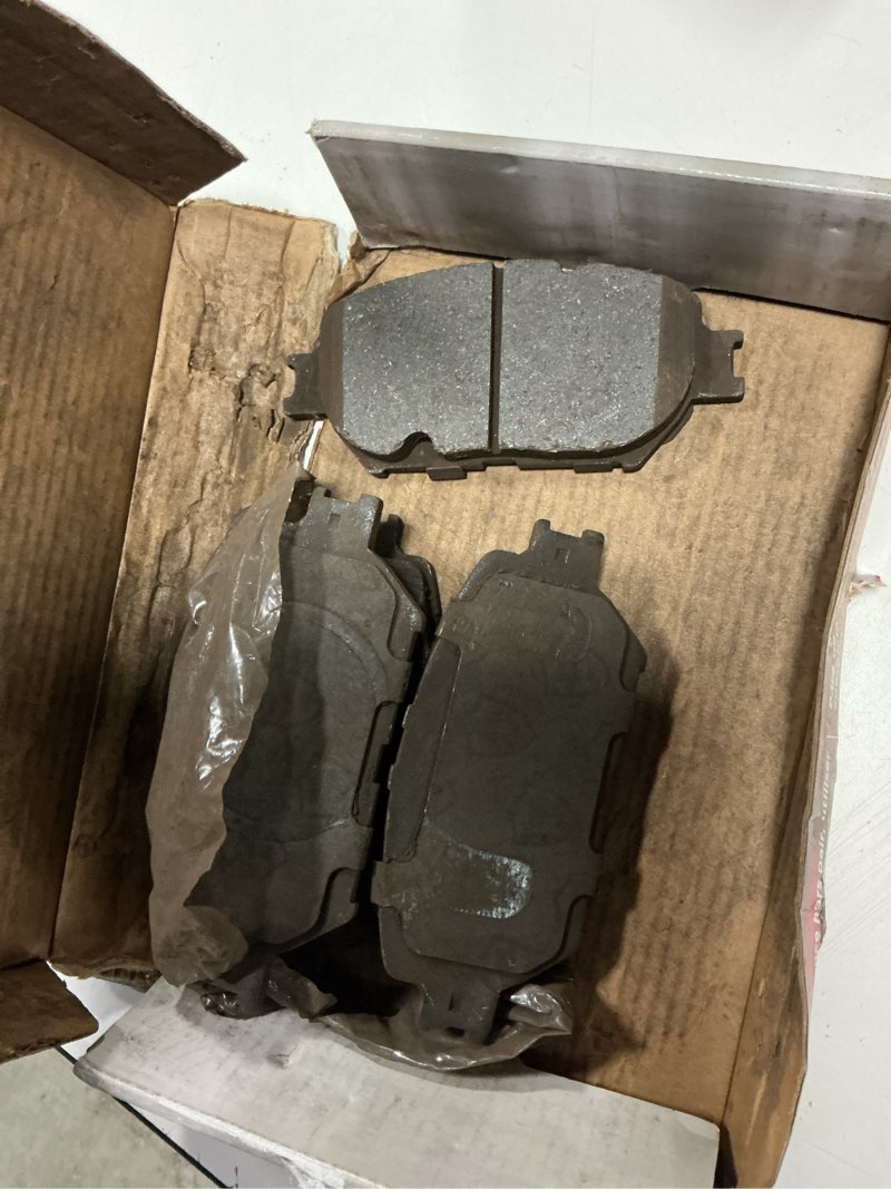 Condition photo showing As Is for disc brake pad set