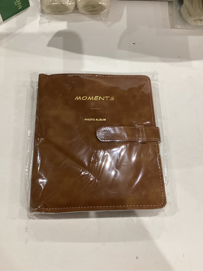 Condition photo showing New/Like New for Hapeper 128 Pockets Photo Album Compatible with Fujifilm Instax Mini 12 11 9 8 90 70 40 Instant Camera Films and 2x3 Inch Photo Paper (Brown)