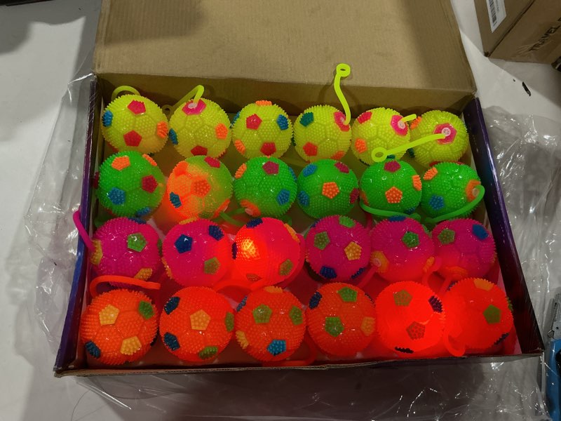 Condition photo showing Good Condition for wettarn 24 pack light up spiky balls for kids 2.6" led glow bouncy balls bulk, flashing sensory fidget stress ball party favors for classroom prizes goodie bag stuffers birthday gifts(soccer)