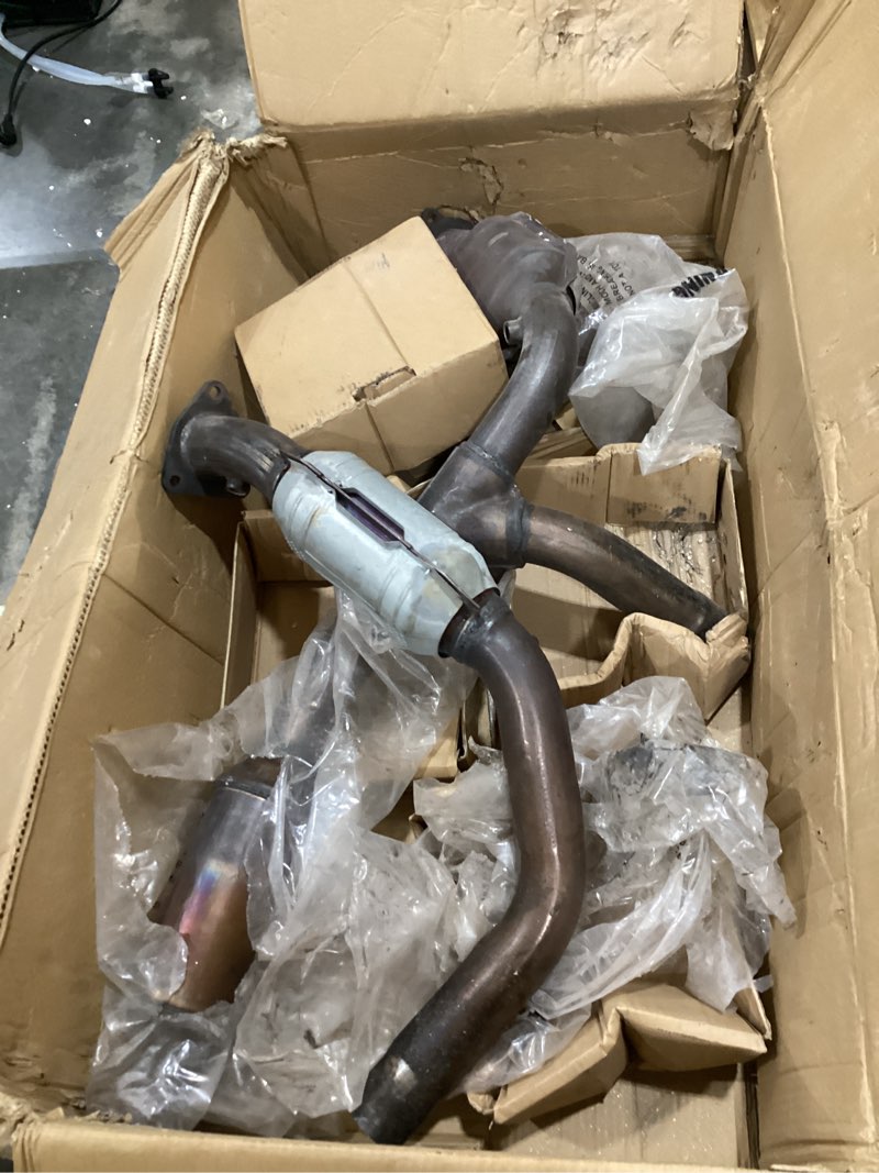 Condition photo showing As Is for automotive exhaust header pipes