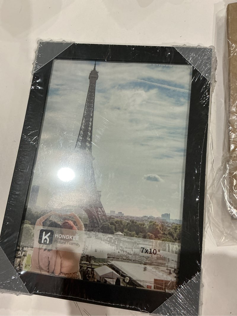 Condition photo showing Good Condition for hongkee 7x10 picture frame, made of real glass and wooden frame, horizontal and vertical display for wall or tabletop (black, 1 pack)