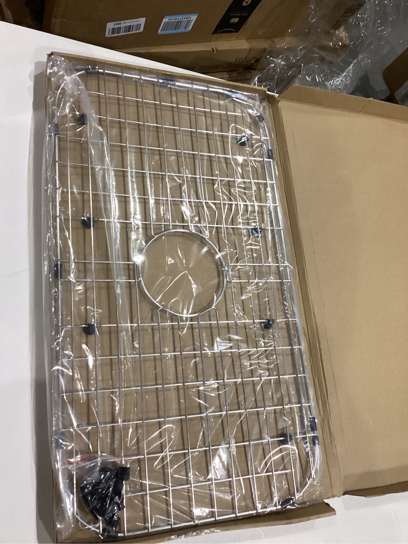 Condition photo showing Good Condition for serene valley sink protector grid 26-1/16" x 14-1/16", centered drain with corner radius 3-1/2", 304 stainless steel material nlw2614c