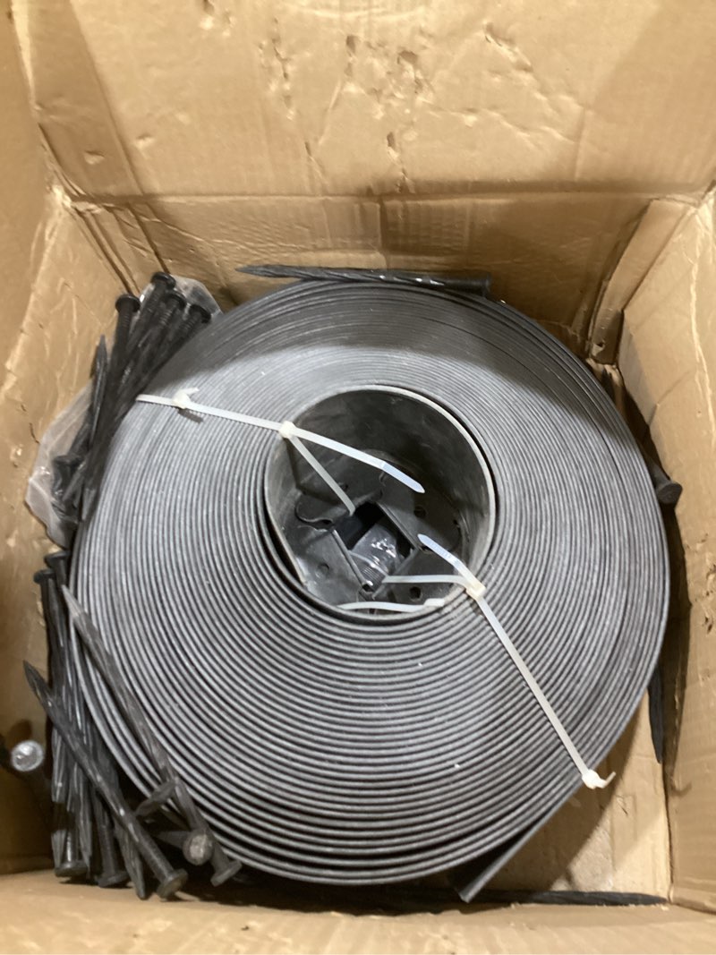 Condition photo showing As Is for 4-inch x 50 ft landscape edging border with 75 spikes, garden edging lawn border kit, plastic edging border flexible for garden flower beds lawn yard pathway paver edging (black) 4 in x 50 ft black