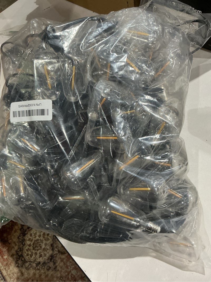 Condition photo showing As Is for oneup outdoor string lights 200ft led patio lights with remote & app,dimmable 2700k warm white,st38 bulbs shatterproof & weatherproof ip44,heavy duty bistro lights for backyard,patio,gazebo,pergola