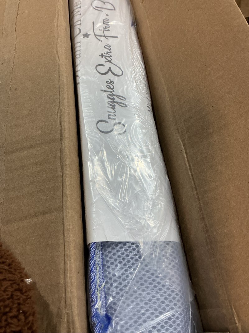 Condition photo showing New/Like New for Dream On Me Snuggles Extra Firm Dual-Sided Baby Crib Mattress with Breathable Fabric, Water & Odor Resistant, GREENGUARD Gold Certified, Fits Mini & Portable Cribs (38”x 24”x 3”) - Periwinkle