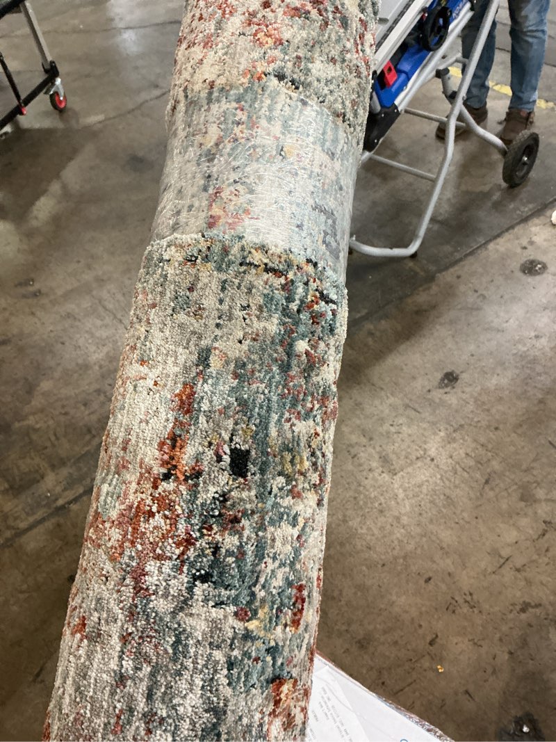 Condition photo showing As Is for Original 7x10in river embers area rug 