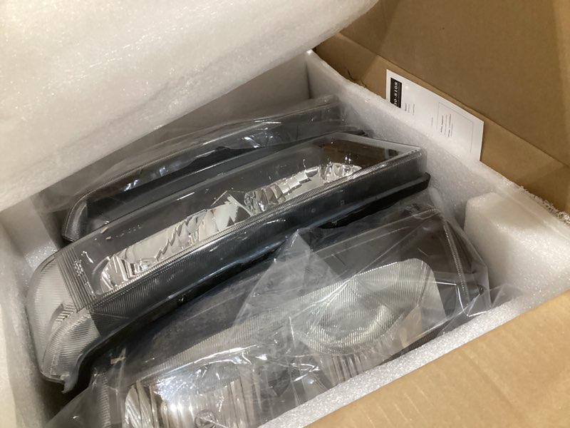 Condition photo showing As Is for dna motoring pair headlight assembly compatible with 2003-2006 chevy silverado 1500 2500 3500 1500 hd 2500 hd avalanche 1500 2500, w/o factory cladding, black/clear, hl-oh-cs03-4p-bk-cl1 black housing clear reflector