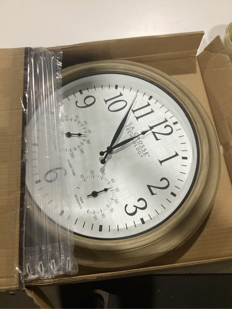 Condition photo showing As Is for la crosse technology 404-18027-int 18-inch indoor/outdoor tan atomic analog wall clock