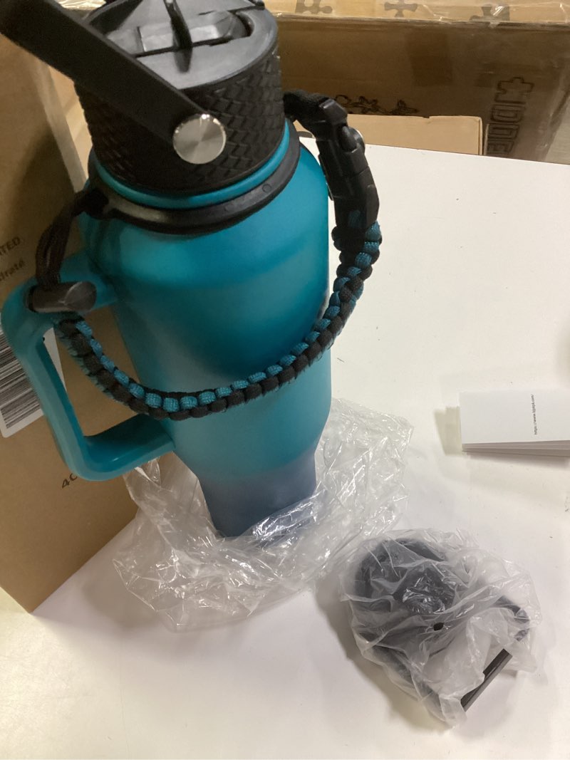 Condition photo showing Good Condition for BJPKPK Insulated Water Bottles with Straw Lid, 40oz Metal Water Bottle with 2 lids & Paracord Strap, Double Wall Stainless Steel Tumbler with Handle, Reusable Cups, Mugs, Thermo, Sea Sea 40oz-Side Handle