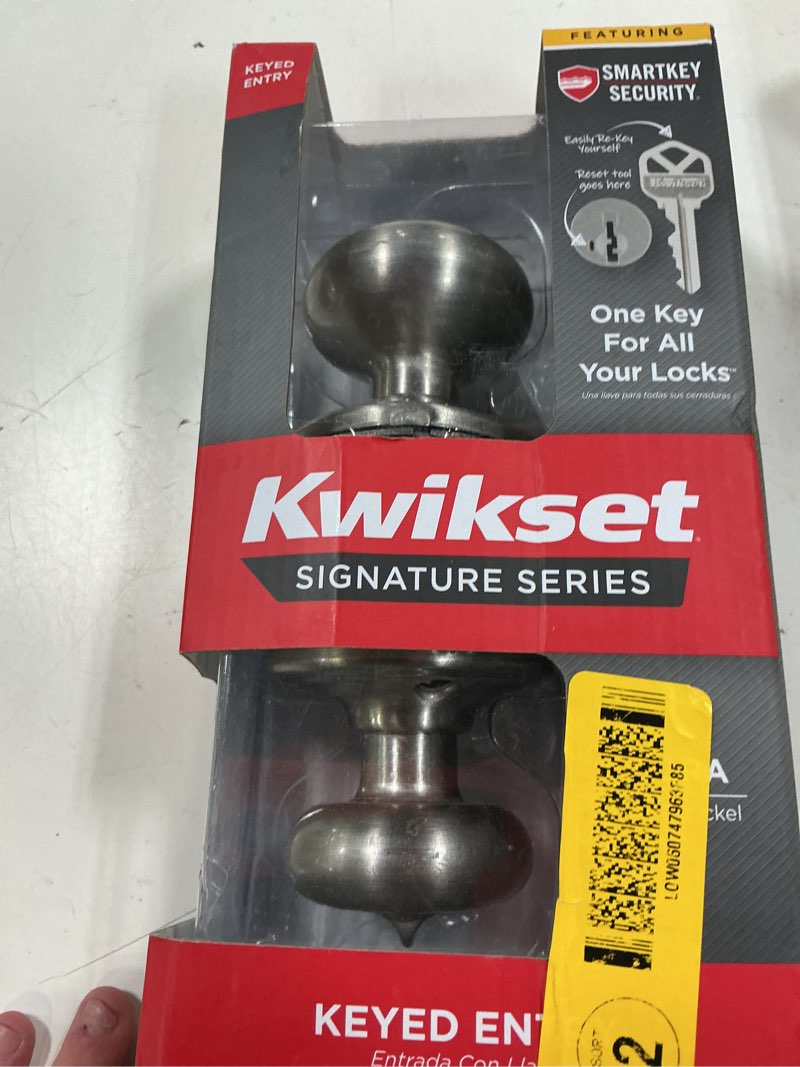 Condition photo showing As Is for sora satin nickel keyed entry 2.19 in. round rose door knob featuring smartkey security