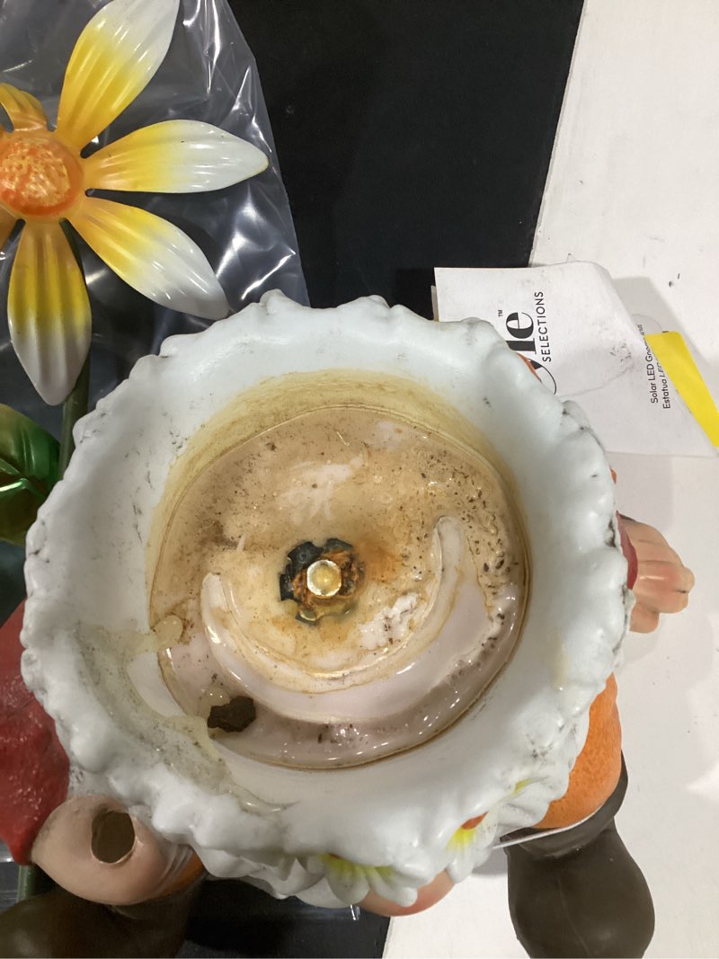 Condition photo showing As Is for style selections solar lighted gnome with flower