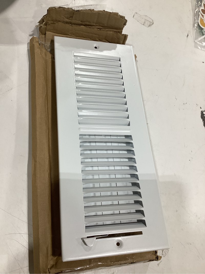 Condition photo showing Good Condition for 12" w x 4" h 2-way-flat stamped steel - vent cover - grille register - sidewall or ceiling - high airflow - white [outer dimensions: 13.75" w x 5.75" h]
