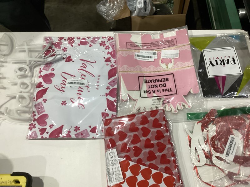 Condition photo showing As Is for Assortment of party decor items 