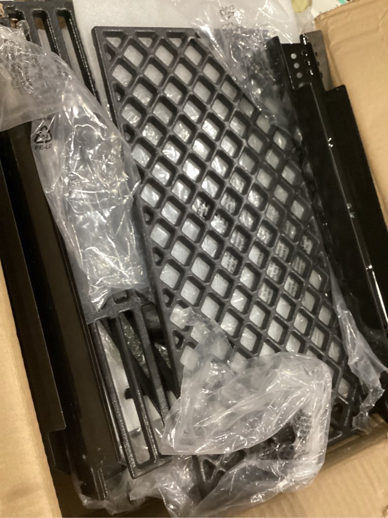 Condition photo showing As Is for grill replacement cast iron grill grates, heat shield plates, burner tubes