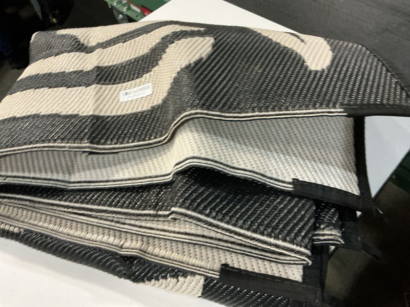 Condition photo showing Good Condition for wonnitar 6x9 outdoor rug, waterproof plastic straw rv outdoor rugs, reversible large portable rv camping rugs, outsided abstract flower patios area rug for deck backyard balcony (black & white, 6'x9') 6' x 9' (rectangular) black