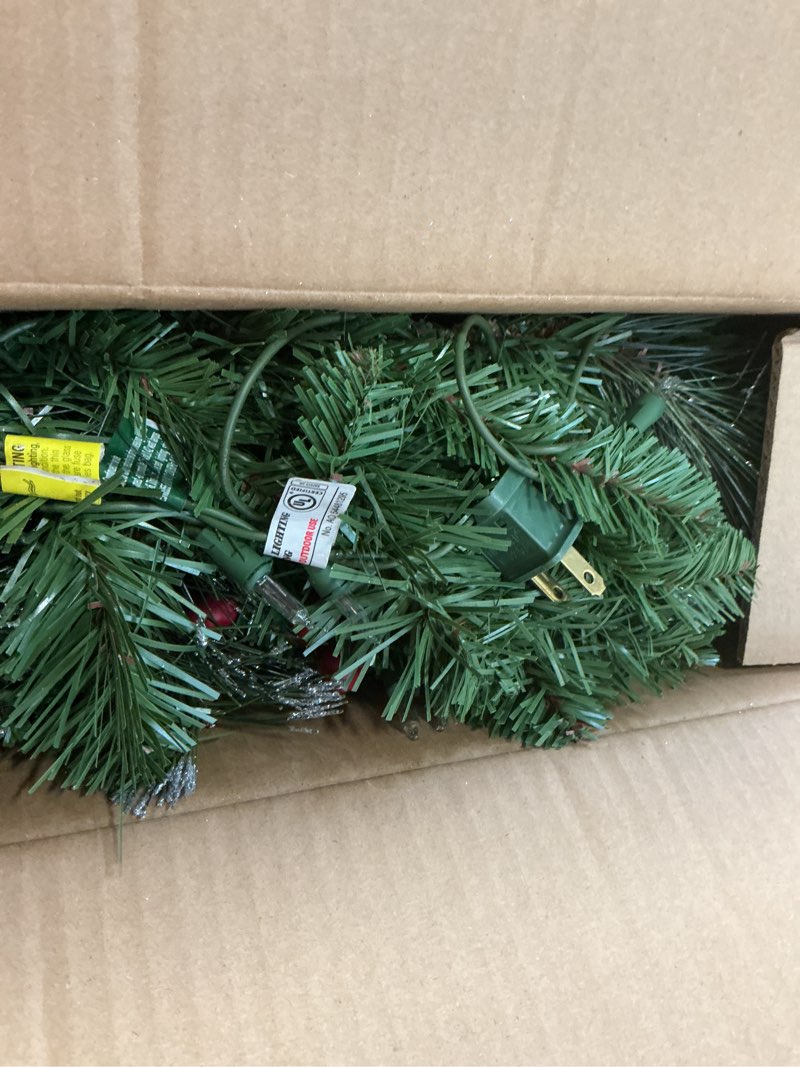 Condition photo showing Good Condition for National Tree Company 24 in Pre-Lit Crestwood Spruce Artificial Christmas Wreath, Christmas Decoration with Glitter, Pinecones, Red Berries, 50 Clear Lights, 160 Tips, Green 24 in Plug In Wreath