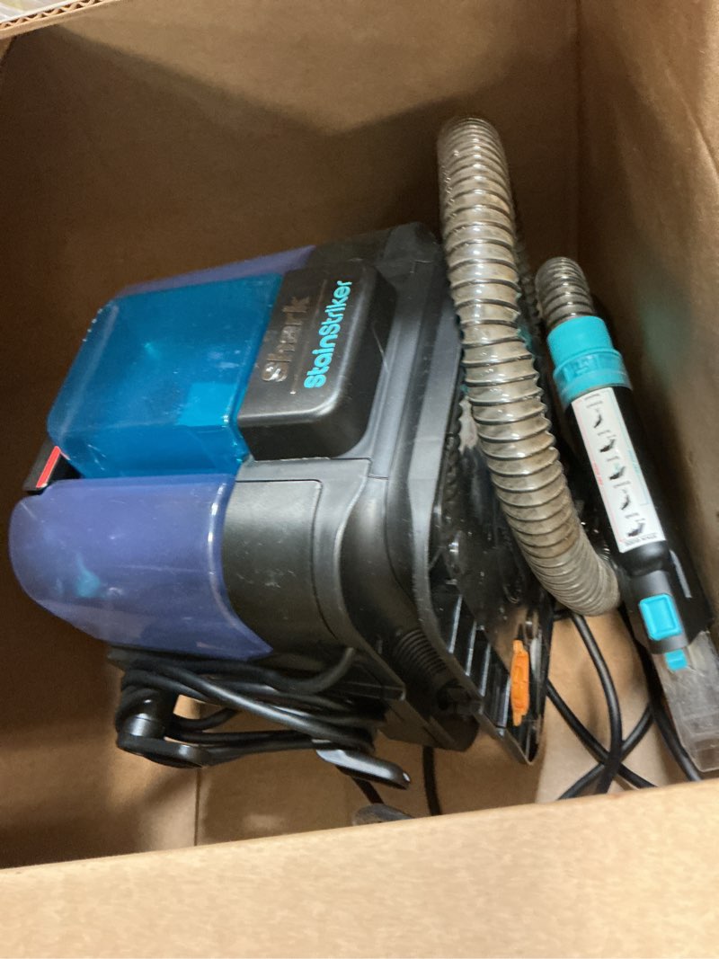Condition photo showing As Is for Shark StainStriker Portable Carpet & Upholstery Cleaner w/on board self cleaning - Spot, Stain, & Odor Eliminator, Includes 2 Cleaning Tools & 2 Cleaning Solutions, Charcoal, PX221BRN StainStriker w/ Onboard Self-Cleaning