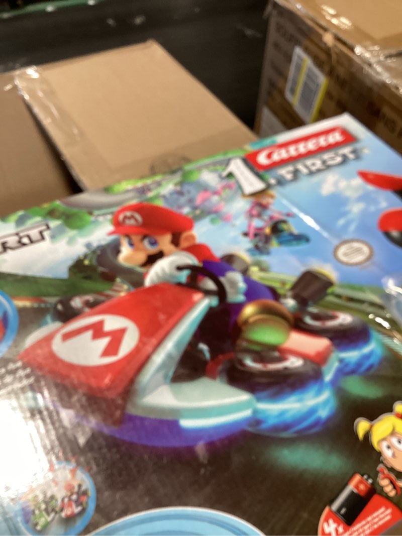 Condition photo showing New/Like New for carrera first nintendo mario kart slot car race track - includes 2 cars: mario and luigi - battery-powered beginner toy racing set for kids ages 3 years and up