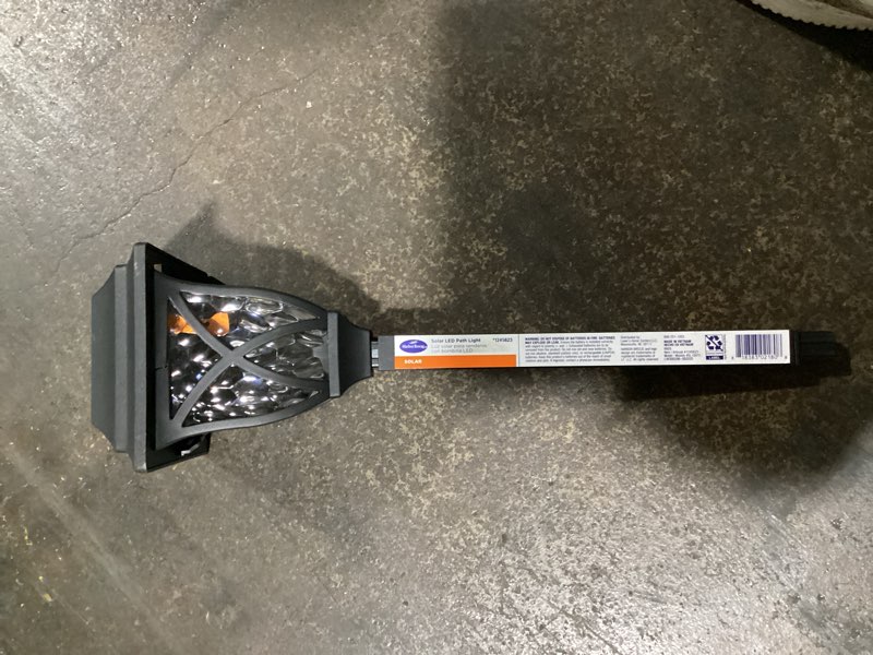 Condition photo showing As Is for (possibly used)harbor breeze 10 -lumens black solar led outdoor path light 3000-k
