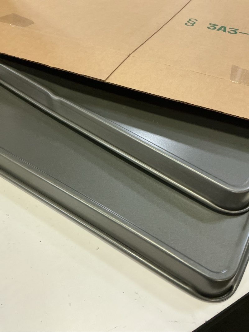 Condition photo showing As Is for goodcook everday nonstick carbon steel 15” x 21” baking sheet set, 2 pack – extra-large carbon steel cooking pans, bakeware set, cookie sheets for baking, oven pan set 15" x 21" (2-piece set)