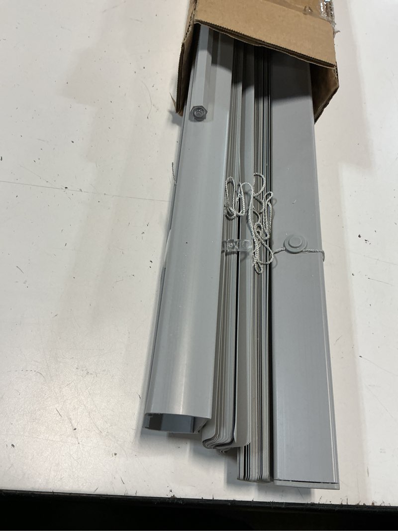 Condition photo showing As Is for chicology cordless mini blinds for indoor windows, 23" w x 36" h, gray vinyl 1" slats with tilt wand, light filtering to room darkening, moisture-resistant, child-safe, screw-mount installation 23"w x 36"h gray (commercial grade)
